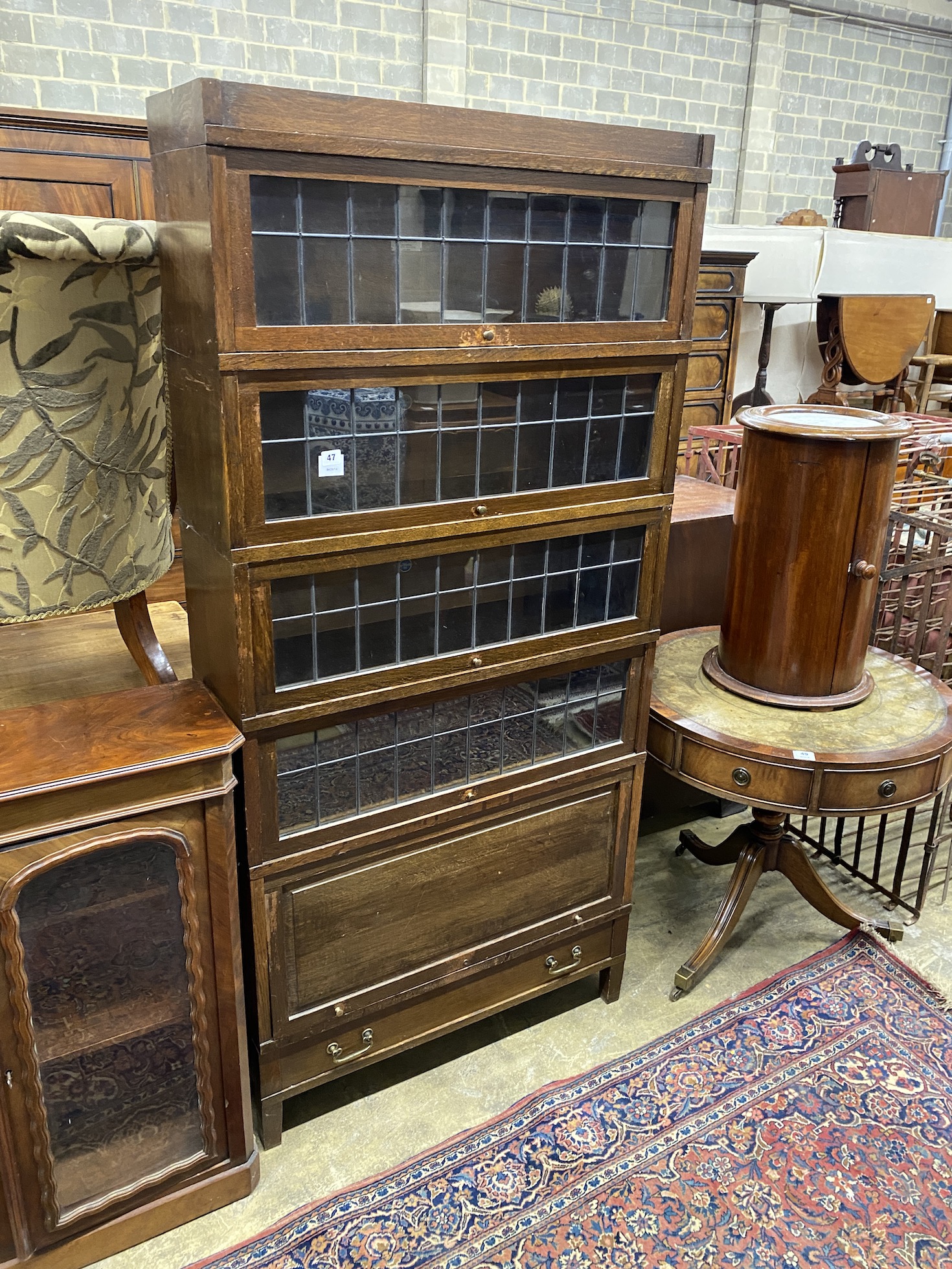 A Globe Wernicke oak five section bookcase with leaded glazed doors, width 87cm, depth 29cm, height 184cm